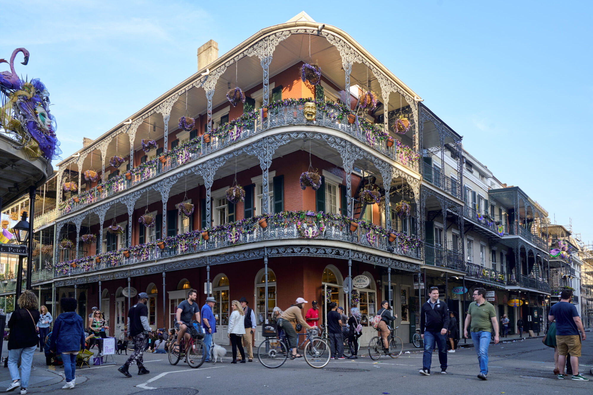 A historic building called the La Branche House in the french quarter with people walking past